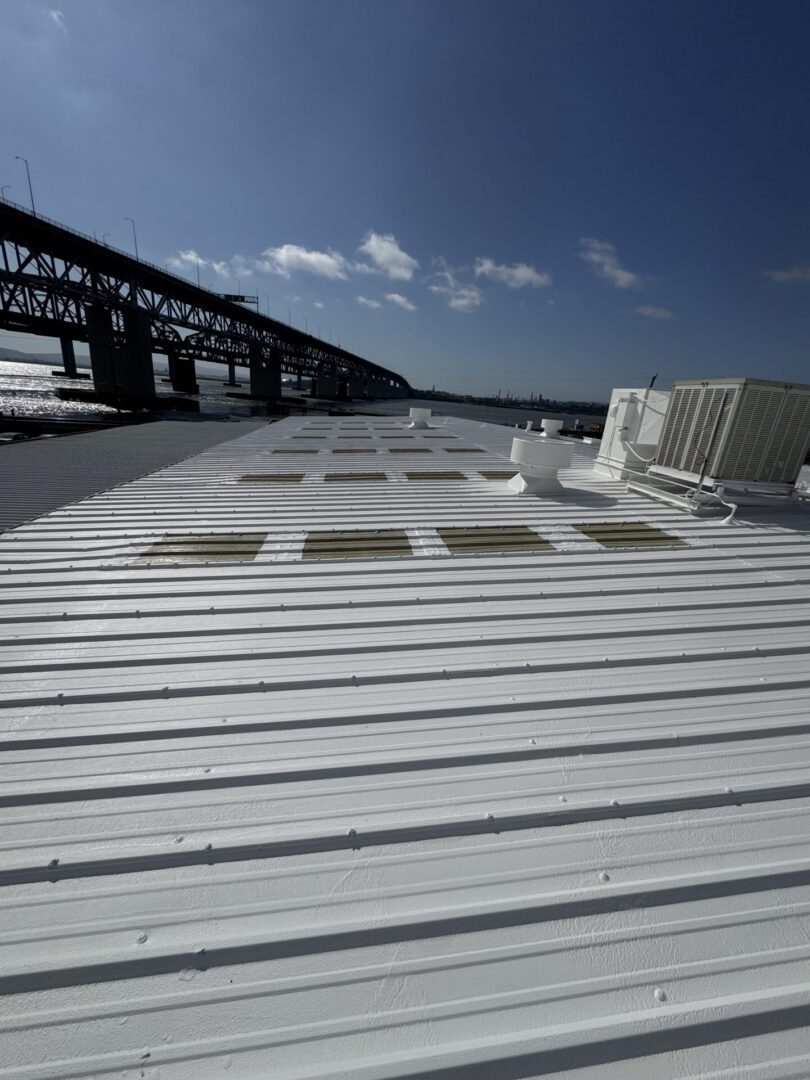 White corrugated roof with bridge and HVAC