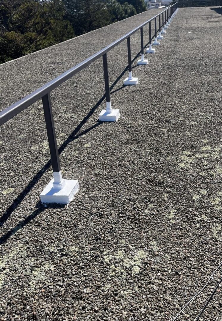 Gravel rooftop with metal safety railing